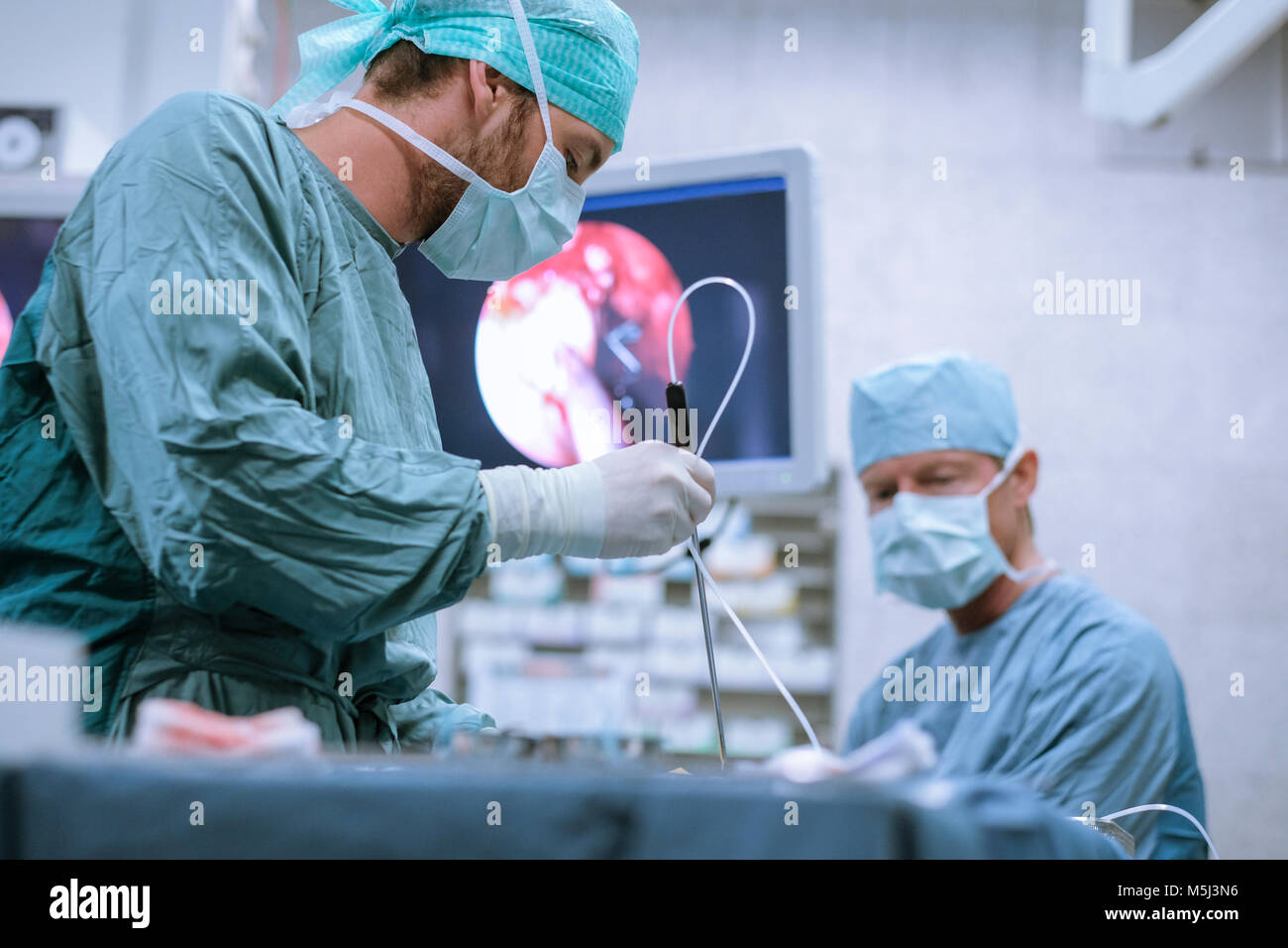Surgical nurse at work during an operation Stock Photo Alamy