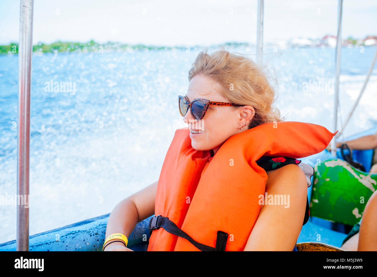 Panama, Woman with life jacket sitting in a boat Stock Photo