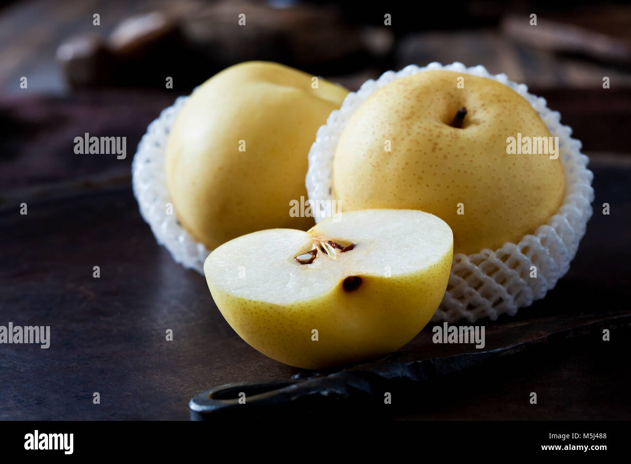 Sliced and whole Nashi pear Stock Photo