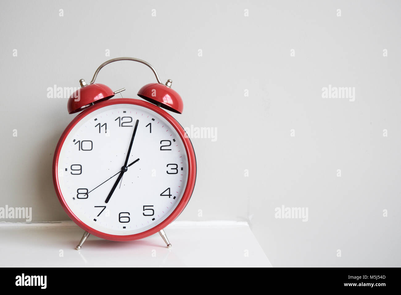 Red alarm clock Stock Photo