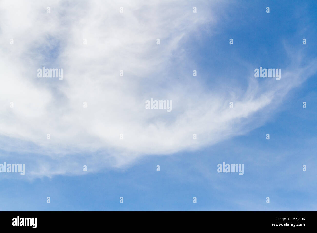 Blue sky background with white fluffy clouds Stock Photo - Alamy