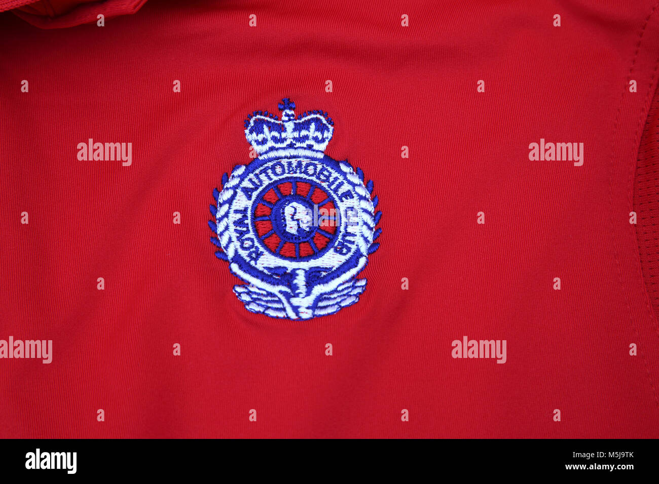 Close up Of Royal Automobile Club Logo on Red Shirt Stock Photo