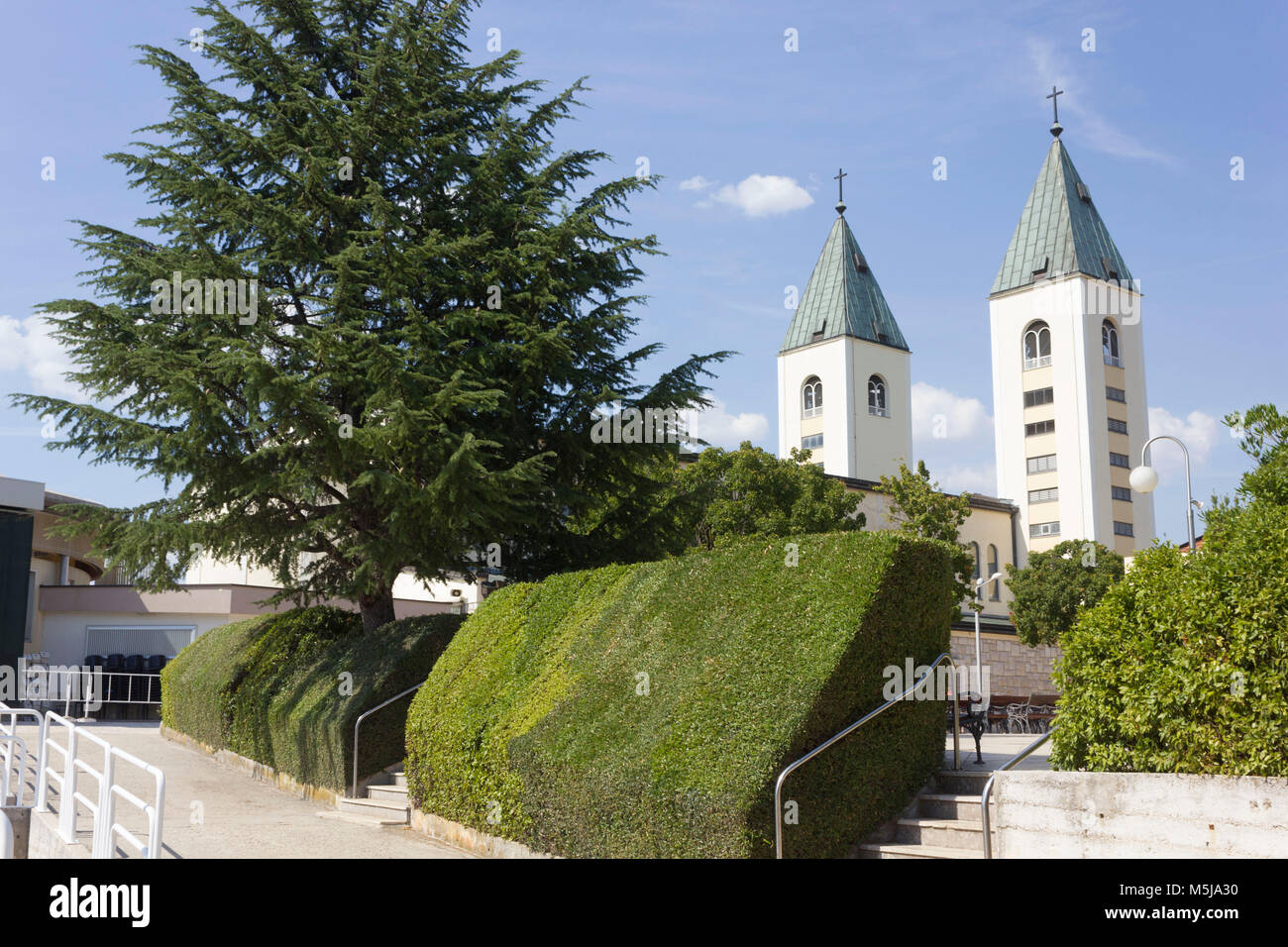 MEDJUGORJE - BOSNIA AND HERZEGOVINA -AUGUST 16 2017: Saint James belfries in Medjugorje in summer season, nobody around Stock Photo