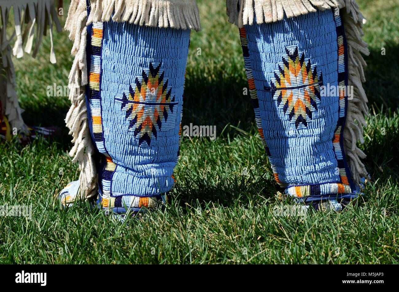 Aboriginal women during a dance competition, with their amazing hand made moccasins and colorful bead work. Stock Photo