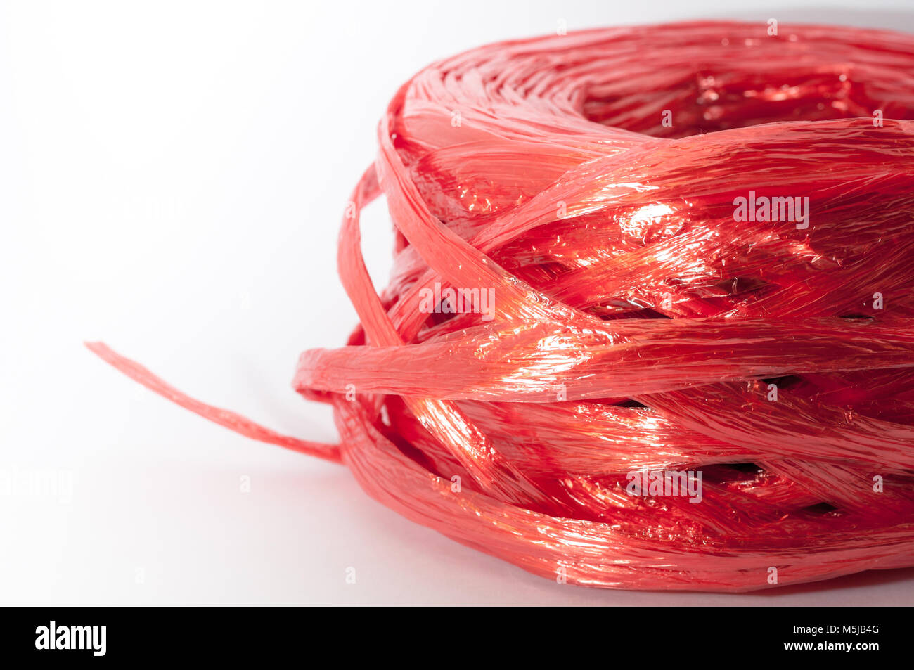Close up Red plastic rope top view on white background Stock Photo - Alamy
