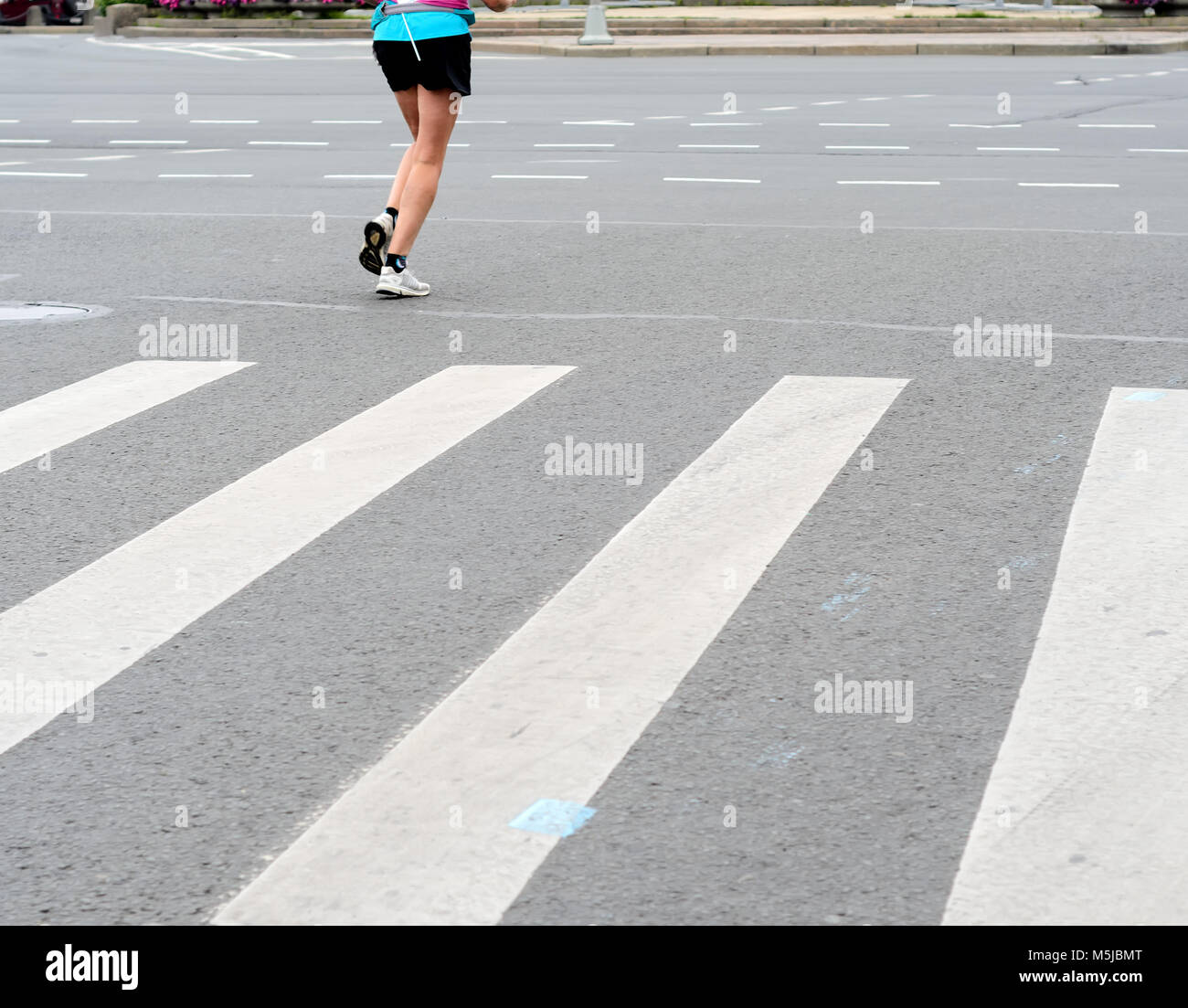 an athletic pair of legs during running Stock Photo