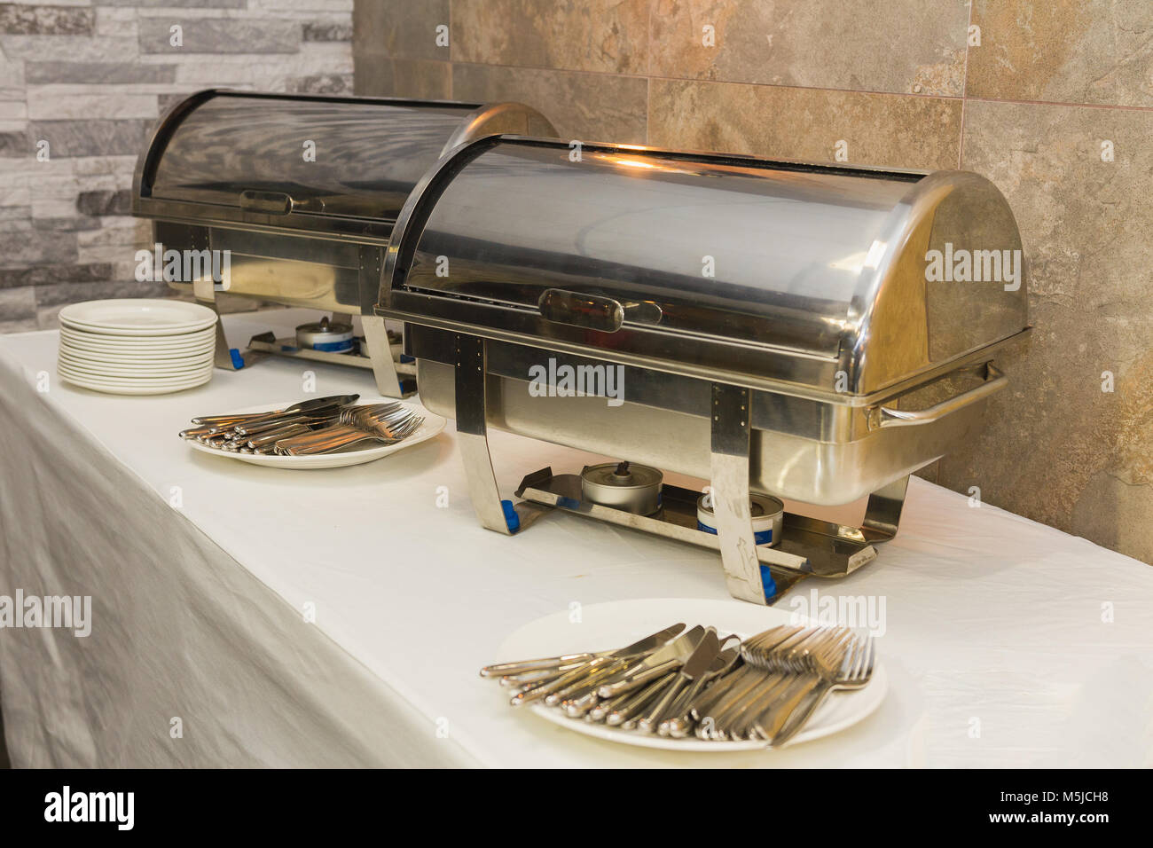 Catering food steel forks and porcelain plates Stock Photo Alamy