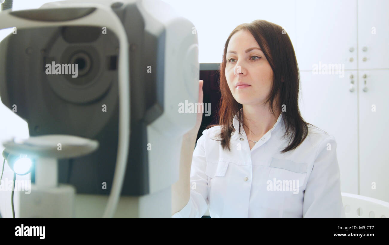 Ophthalmologist in eyes clinic doing diagnostic for patient high