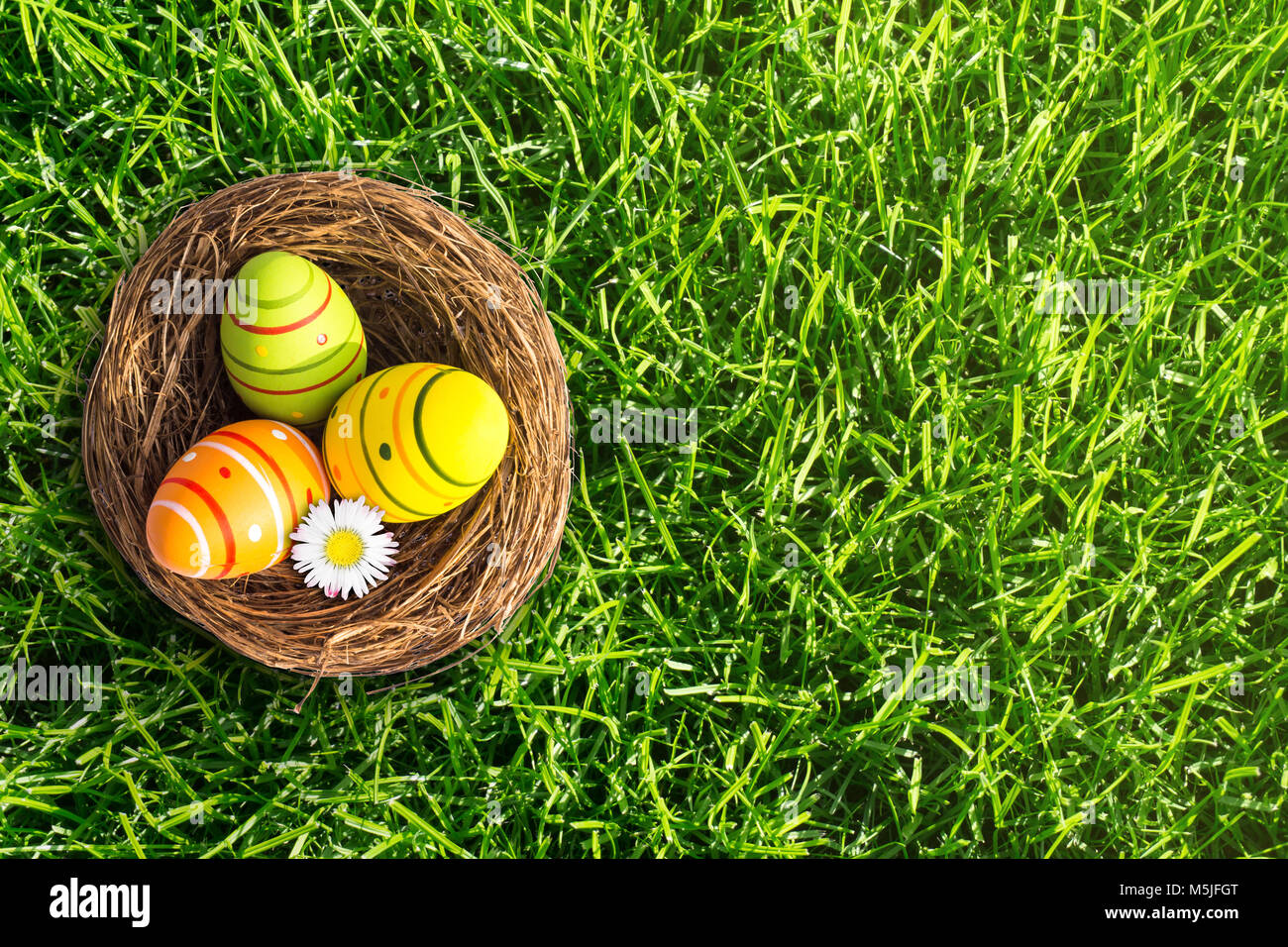 easter basket in the meadow Stock Photo