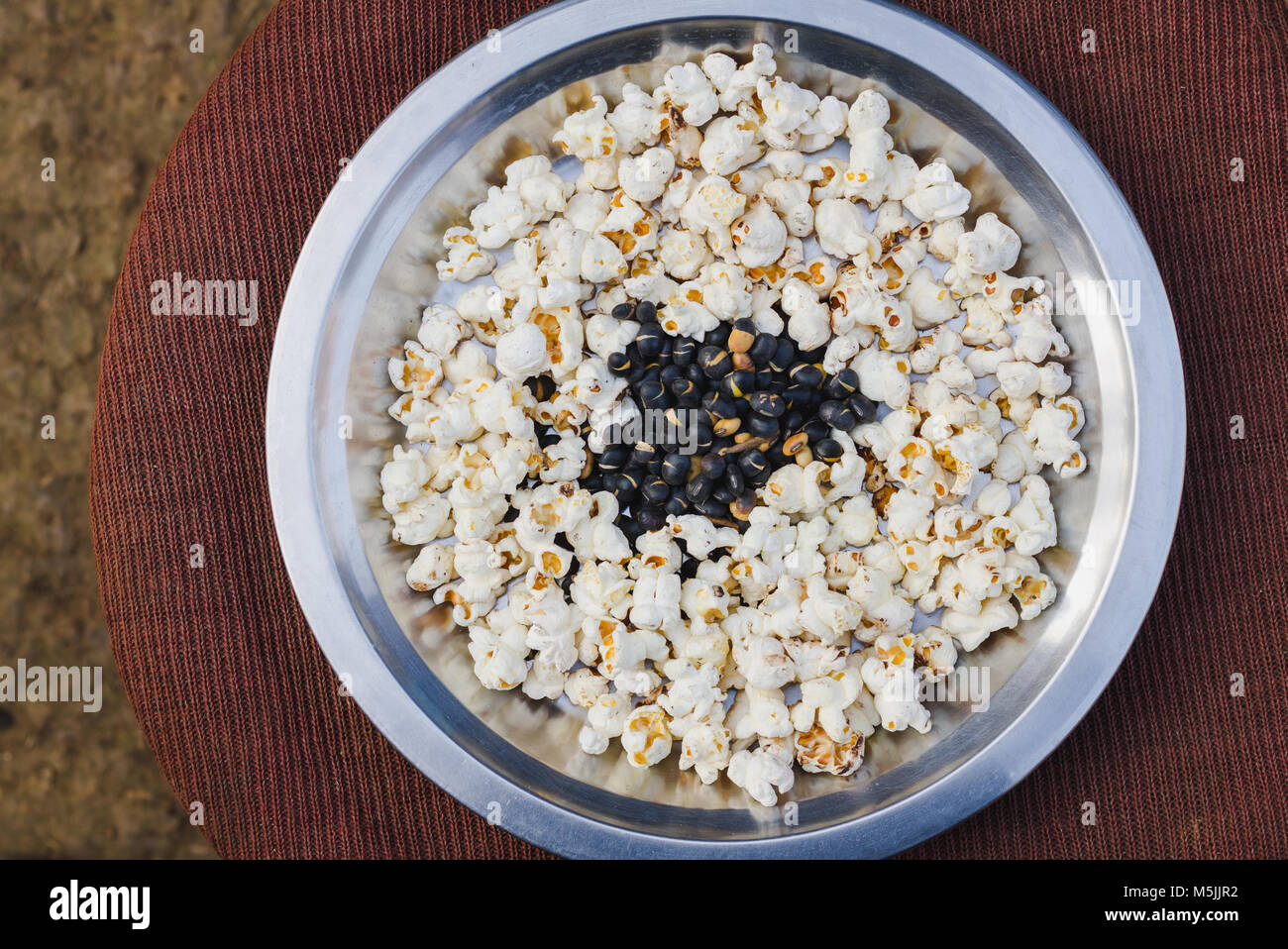 Nepali Traditional Snacks Popcorn and Fried Soybean on a plate Stock