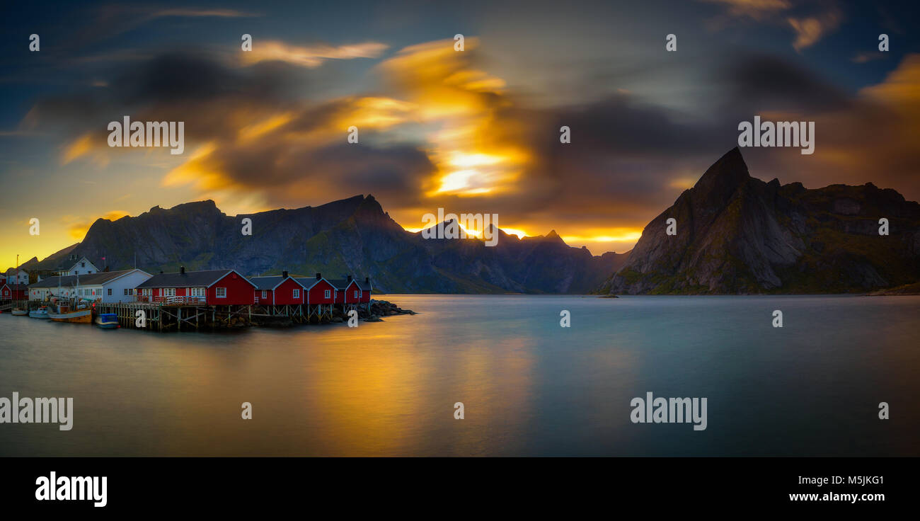 Sunset above mount Olstind and the village of Hamnoy in Norway Stock Photo