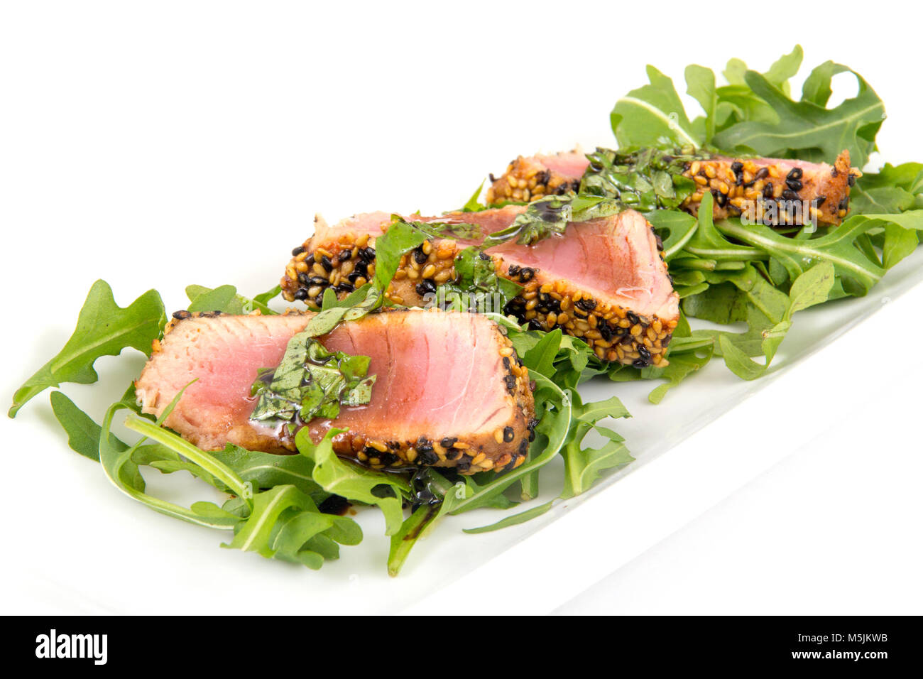 tuna tataki sesame crust appetizer plate over wood backgroung Stock