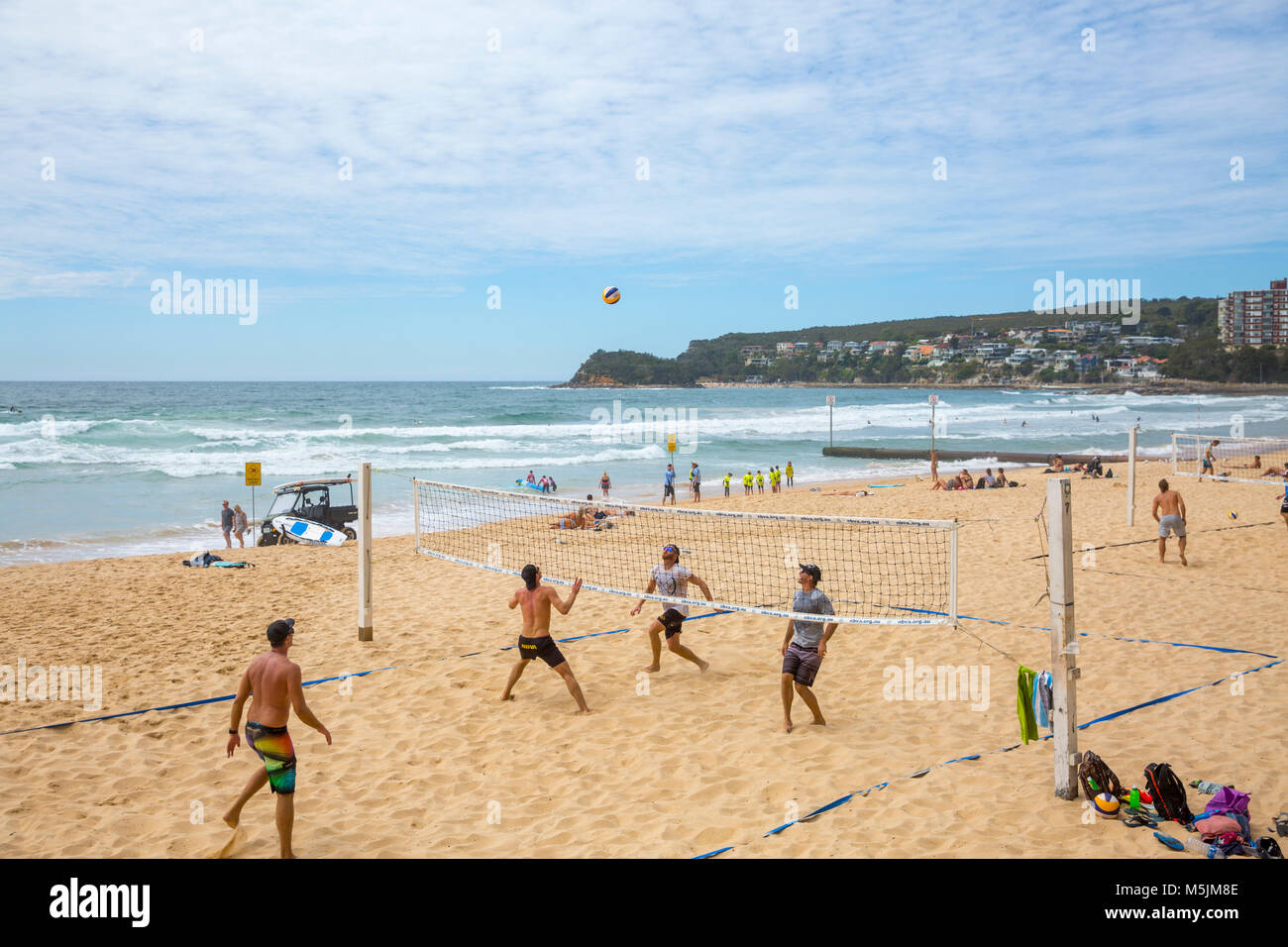 Teams playing beach volleyball on Manly beach in Sydney,Australia Stock Photo