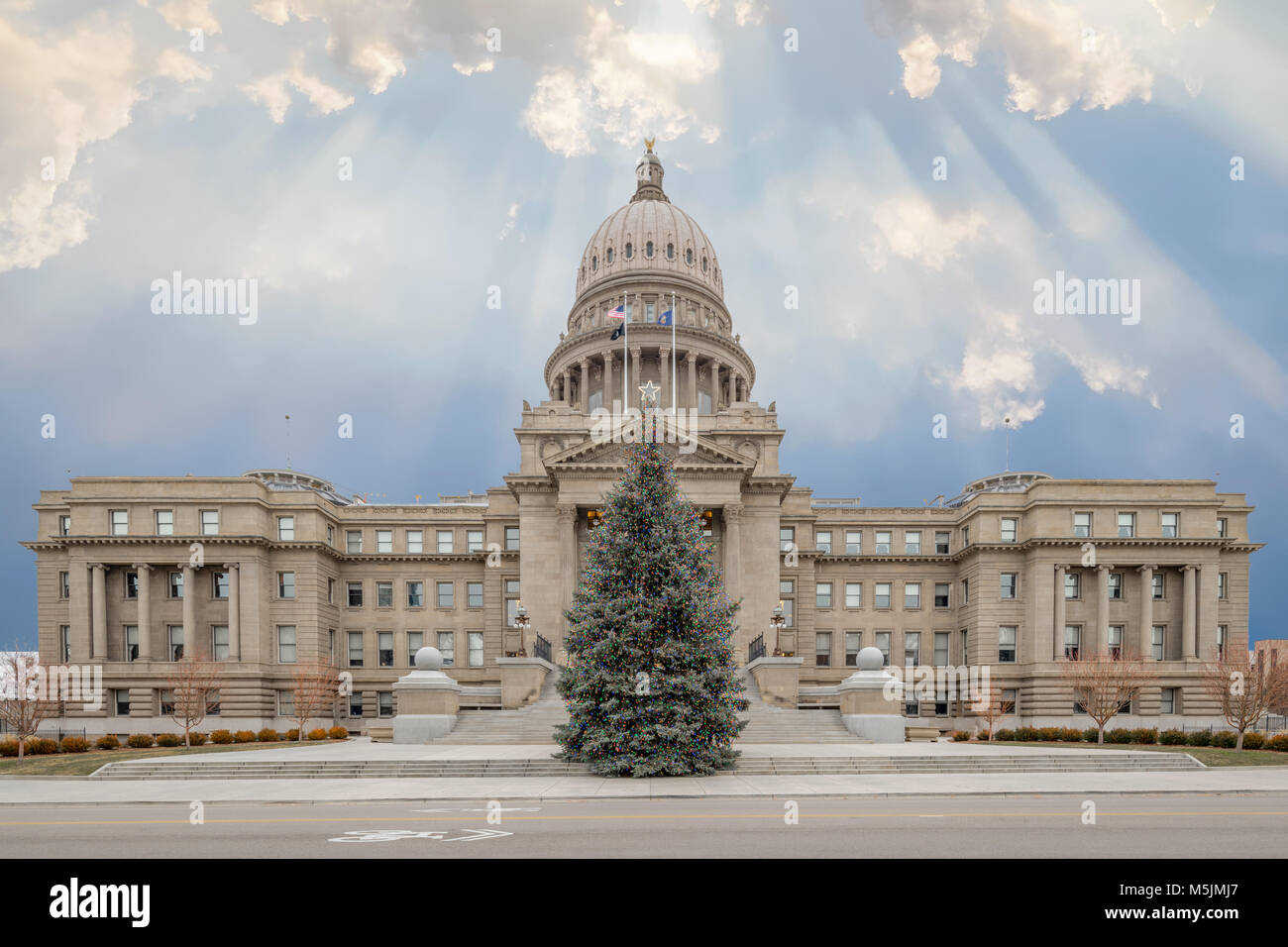 Christmas tree stands infron of the State capital of Idaho Stock Photo