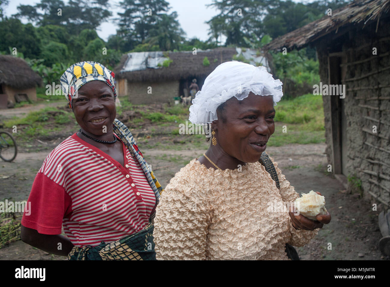 Women  sell palm oil in rural Sierra Leone Stock Photo