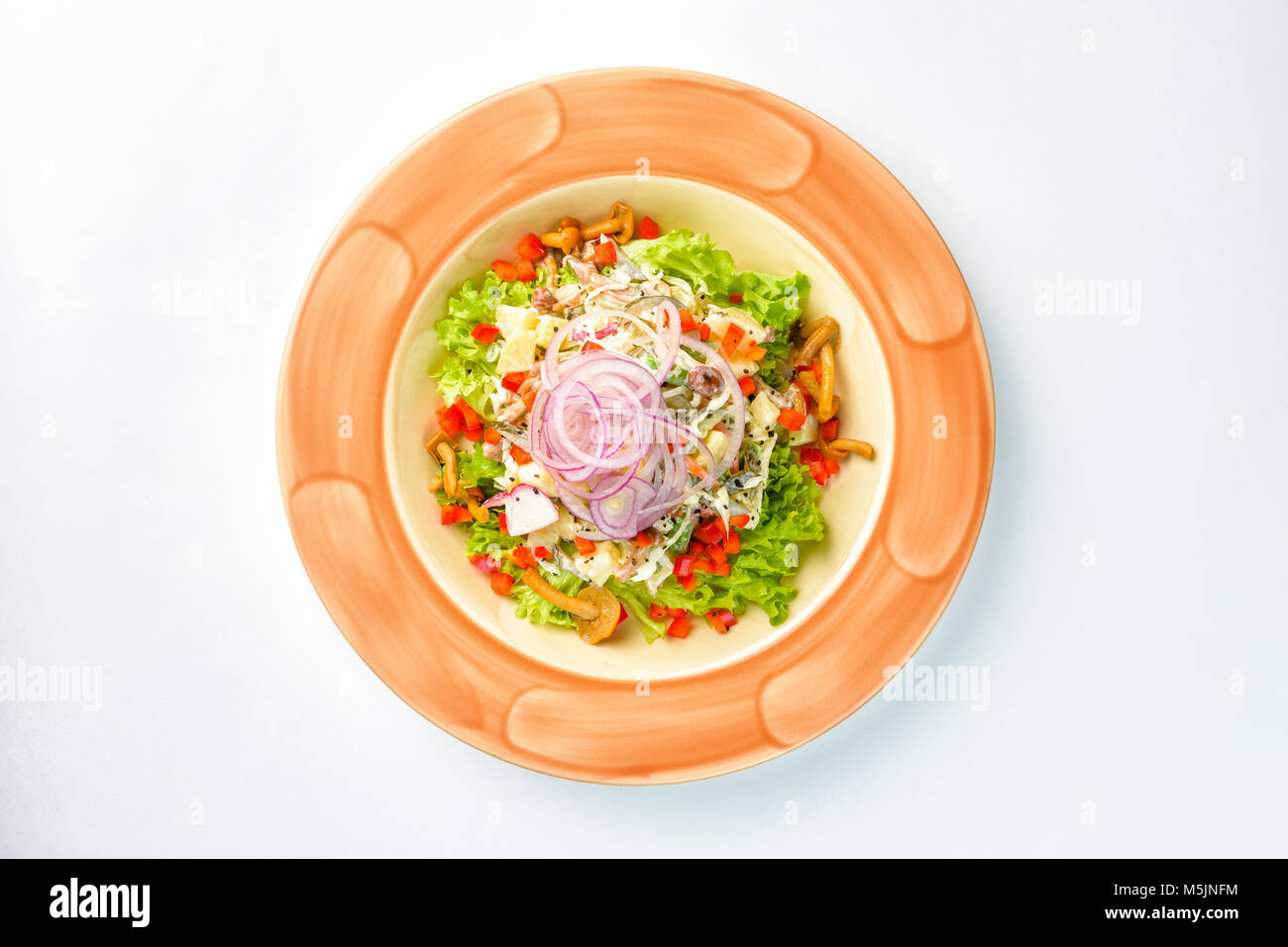 Salad with Greens, onions and mushrooms on a white background Stock ...