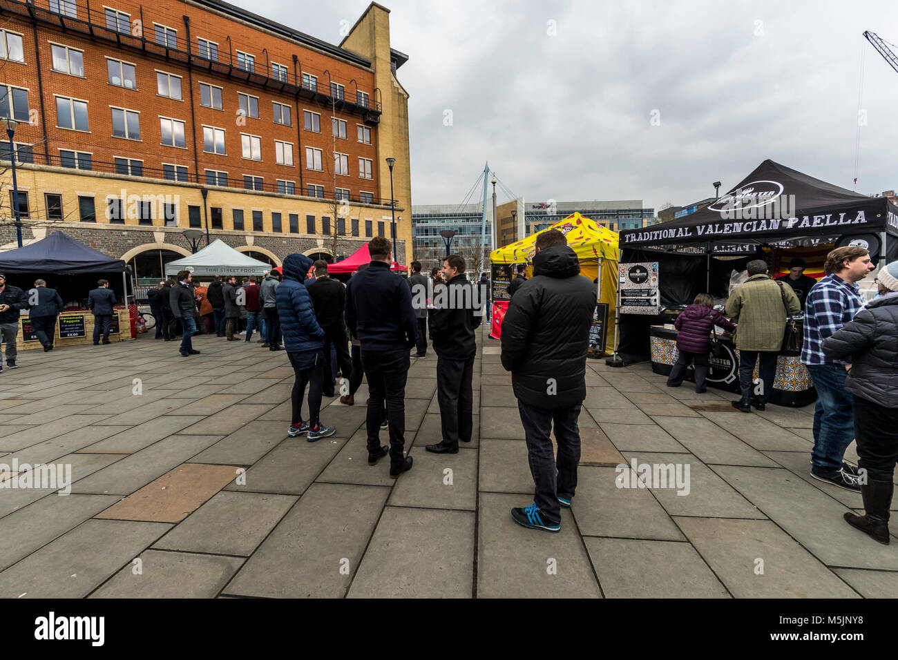 Customers queuing for Thai food. Street food stands, Temple Quay