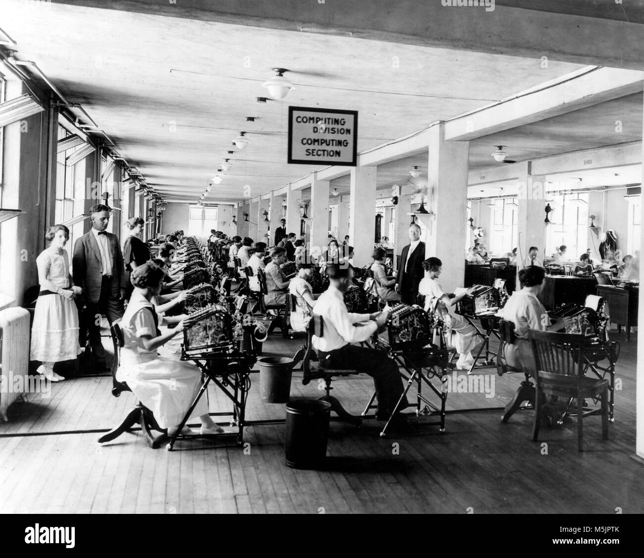 Men and women at the typewriter,open-plan office,1930s,USA Stock Photo