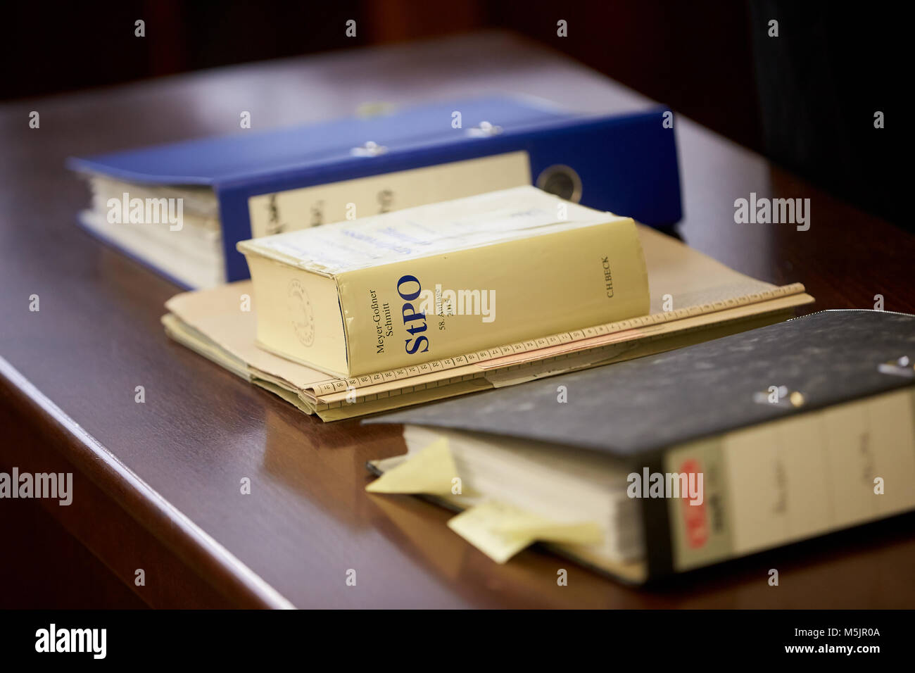 Trial files and Criminal Procedure Code StPO on the table in the courtroom,Koblenz District Court,Rhineland-Palatinate Stock Photo