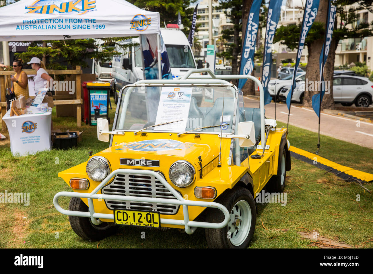 Yellow Austin Leyland mini moke vehicle at Manly beach in Sydney,Australia Stock Photo