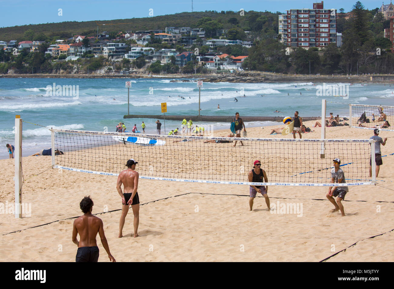 People playing beach volleyball on Manly beach in Sydney, New South Wales,Australia Stock Photo