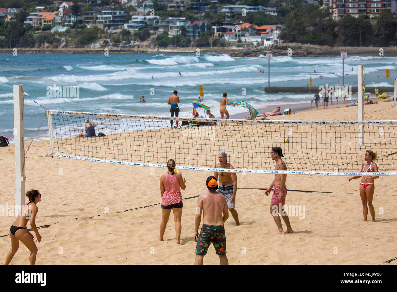 People playing beach volleyball on Manly beach in Sydney, New South Wales,Australia Stock Photo