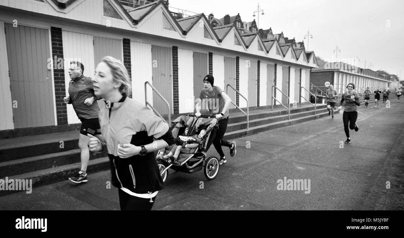 park run runners on promenade lowestoft suffolk uk Stock Photo