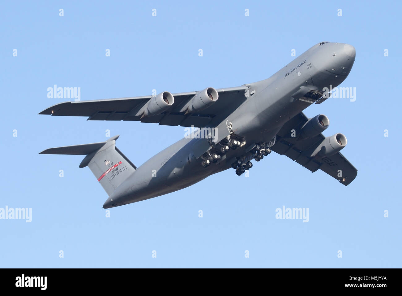 Lockheed C-5M Super Galaxy from the 439th AW departs and climbs out of RAF Mildenhall on a clear winters morning. Stock Photo