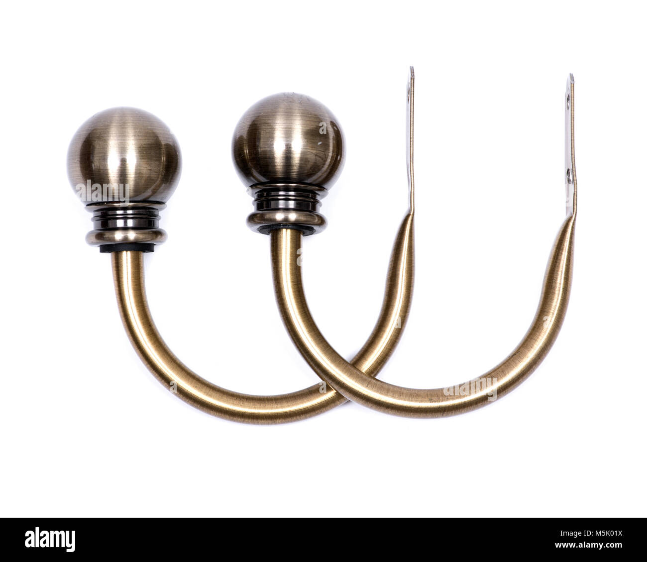 Brass ball window curtain holdback pair isolated on white background
