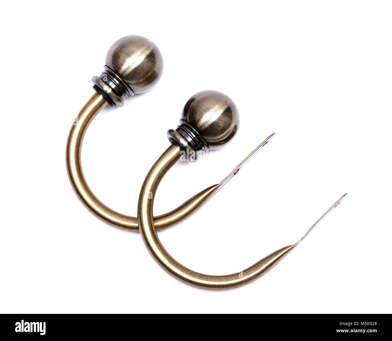 Brass ball window curtain holdback pair isolated on white background