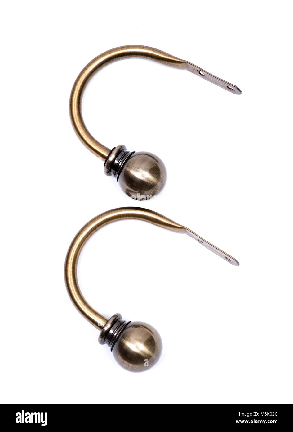 Brass ball window curtain holdback pair isolated on white background
