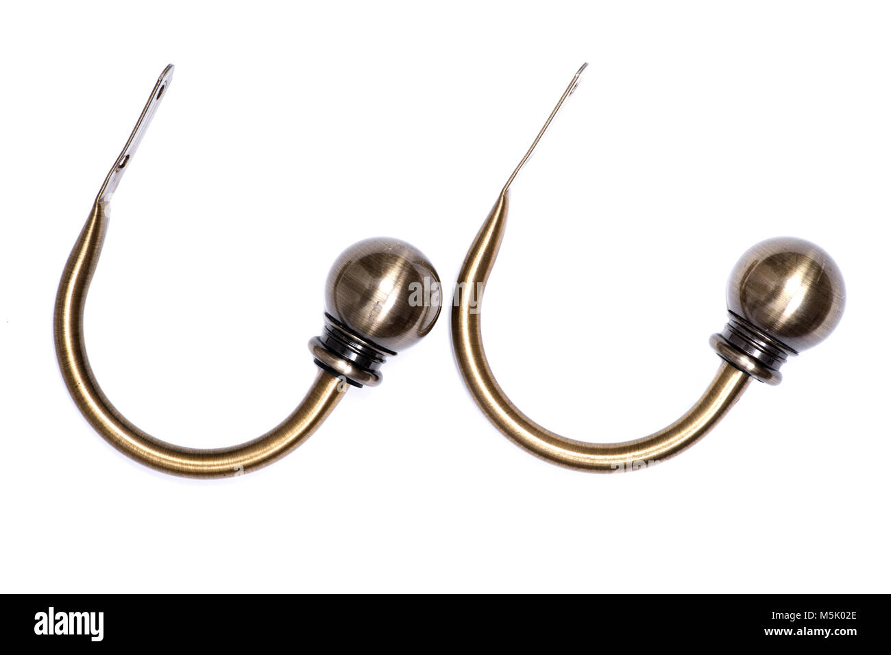 Brass ball window curtain holdback pair isolated on white background
