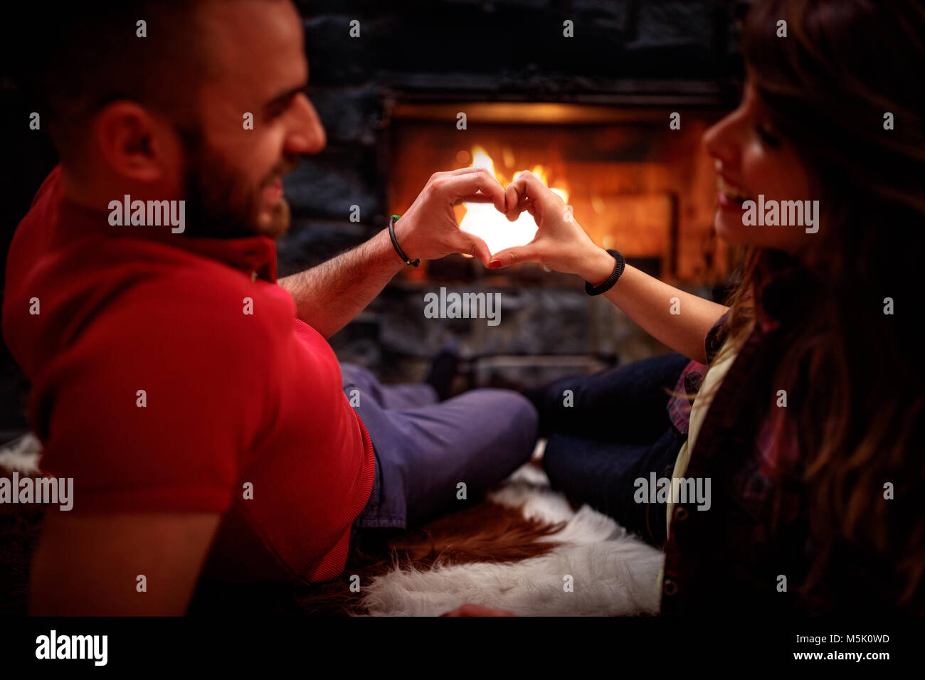 Young couple in love at home and heart shape Stock Photo - Alamy