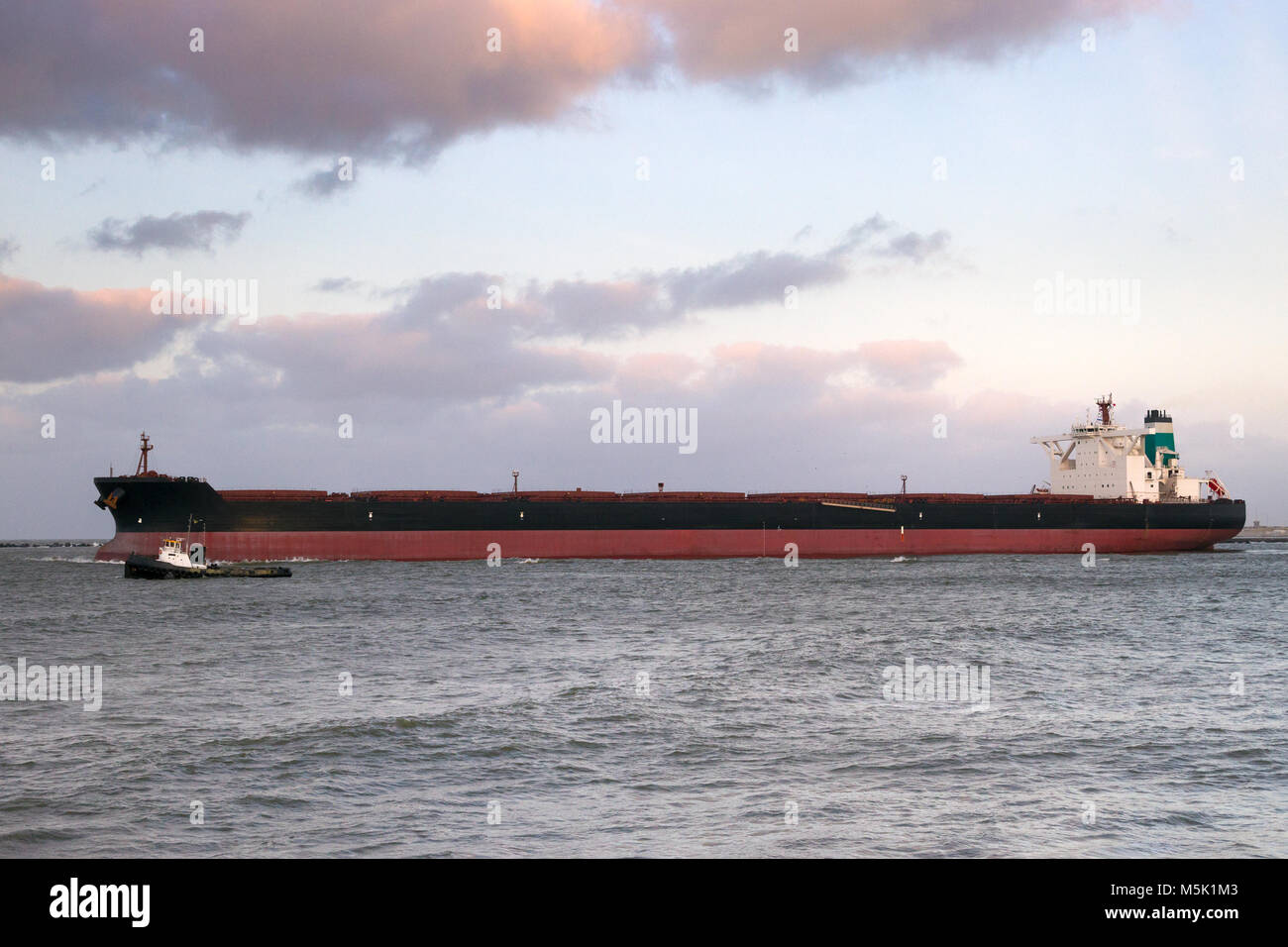 Large oil tanker leaving the Port of Rotterdam. Stock Photo
