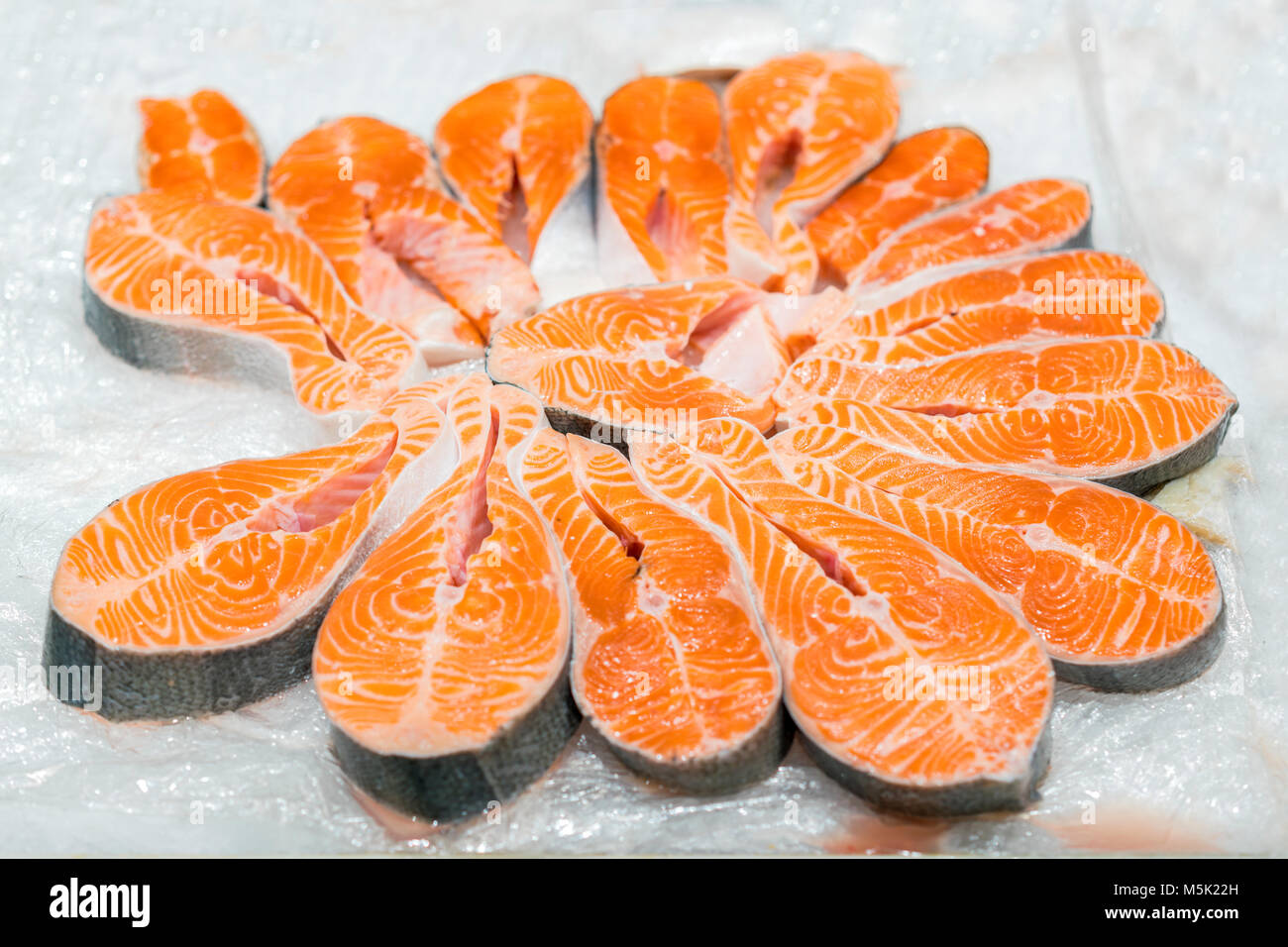 The big pieces of red fish on ice in the fish market. Stock Photo