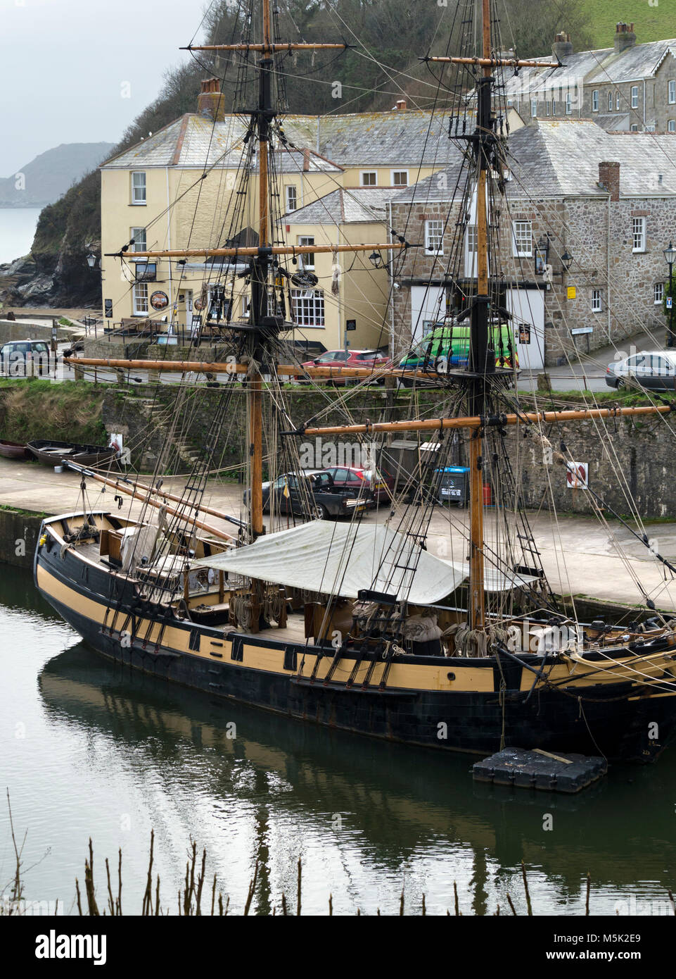 The Phoenix tall ship, wooden sailing ship moored in Charlestown Harbour, Cornwall, England. Charlestown was used as a location for filming Poldark. Stock Photo