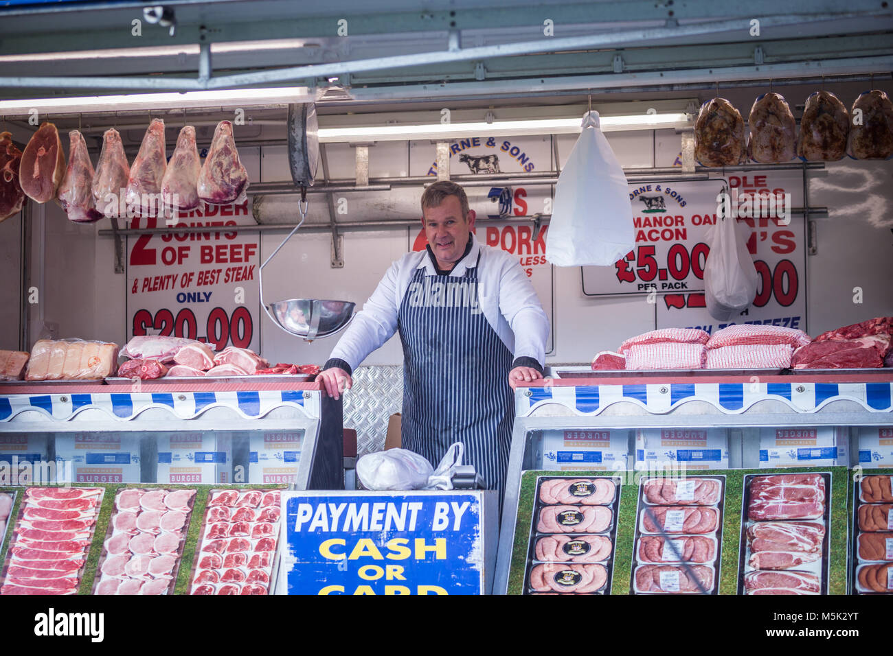 Butcher with his shop or stall, UK Stock Photo Alamy