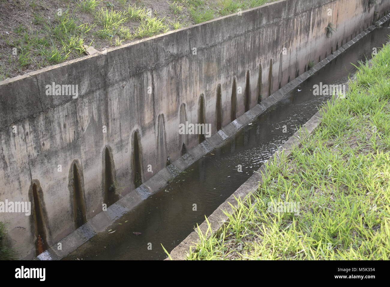 Retaining Wall With Sewer Pipe And Tribal Design Stock Photo Alamy