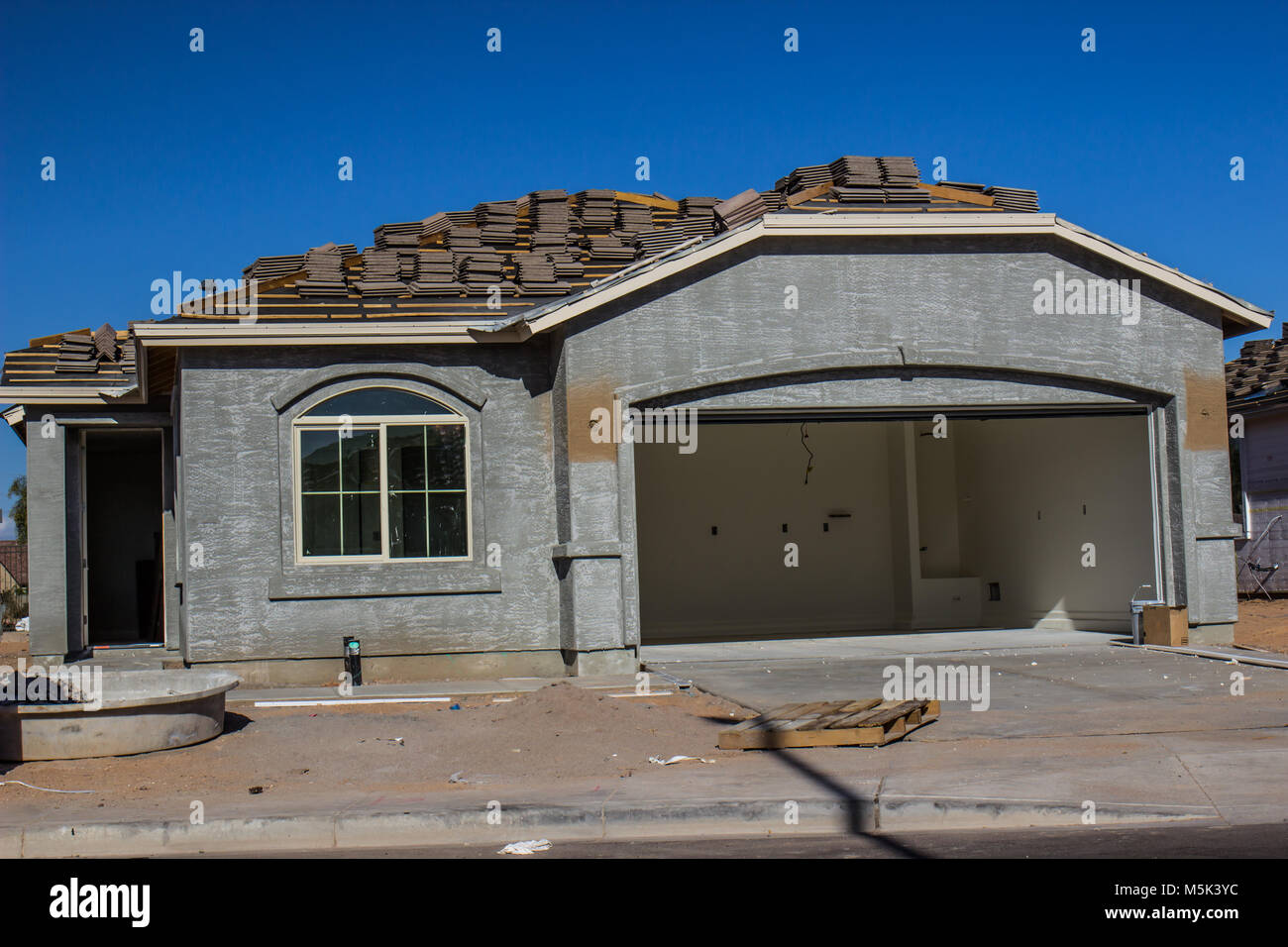 New Home Under Construction With Roofing Materials Stock Photo Alamy