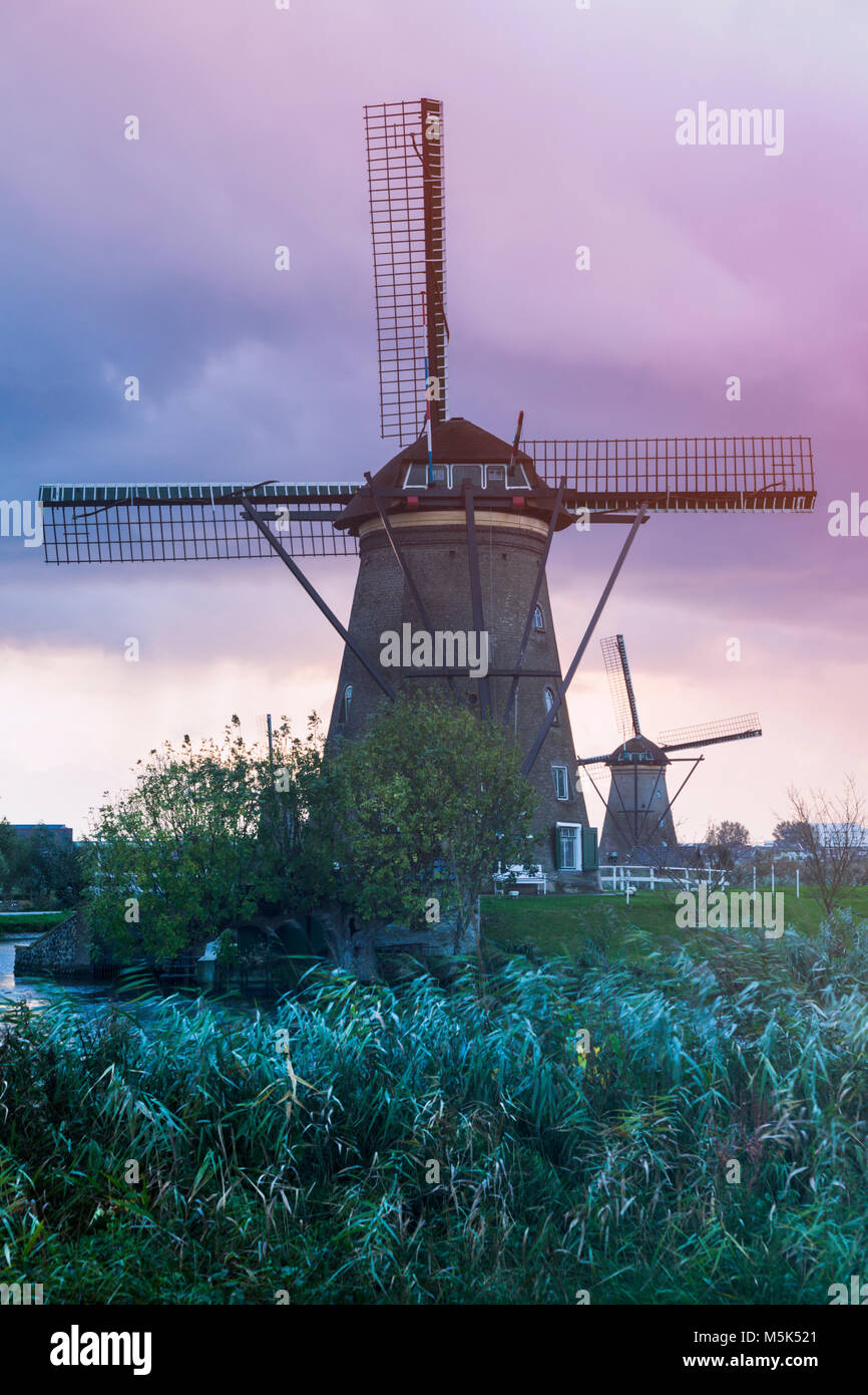 Windmills at Kinderdijk seen during sunset. Kinderdijk, South Holland, Netherlands Stock Photo