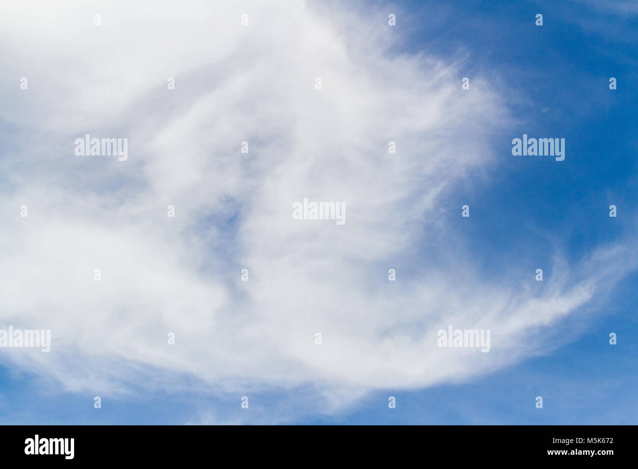 Blue sky background with white fluffy clouds Stock Photo - Alamy