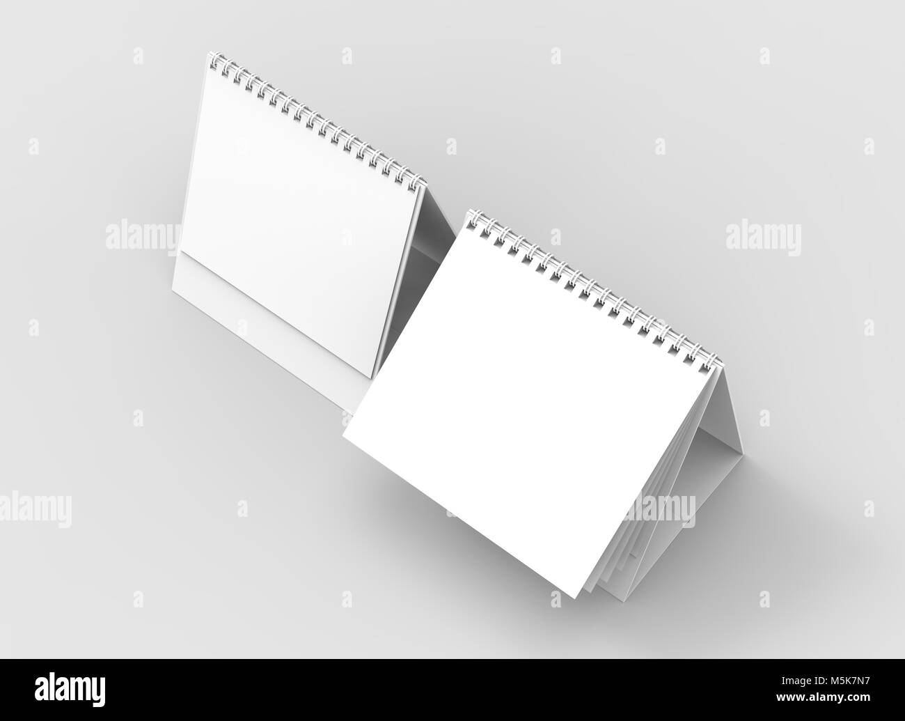 Desktop spiral binding calendar isolated on soft gray background. 3D