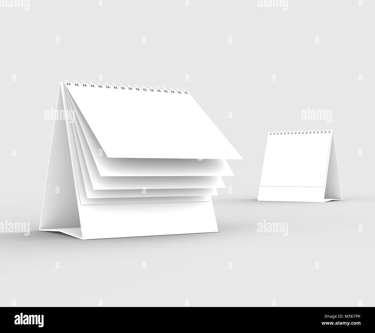 Desktop spiral binding calendar isolated on soft gray background. 3D