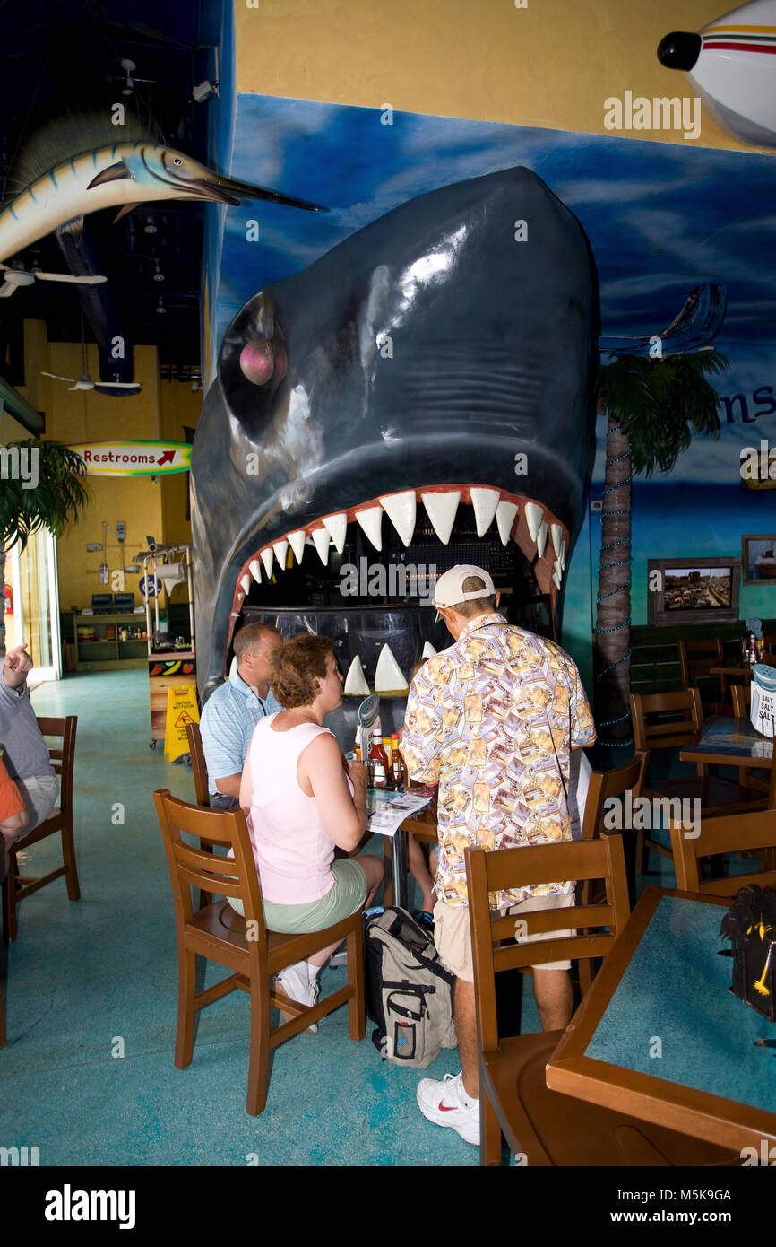 Tourists at popular divers bar Margaritaville, giant artificial shark mouth, San Miguel, Cozumel, Mexico, Caribbean Stock Photo
