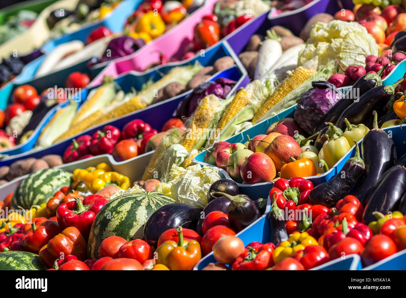 Farmers fruit market with various colorful fresh fruits and vegetables ...