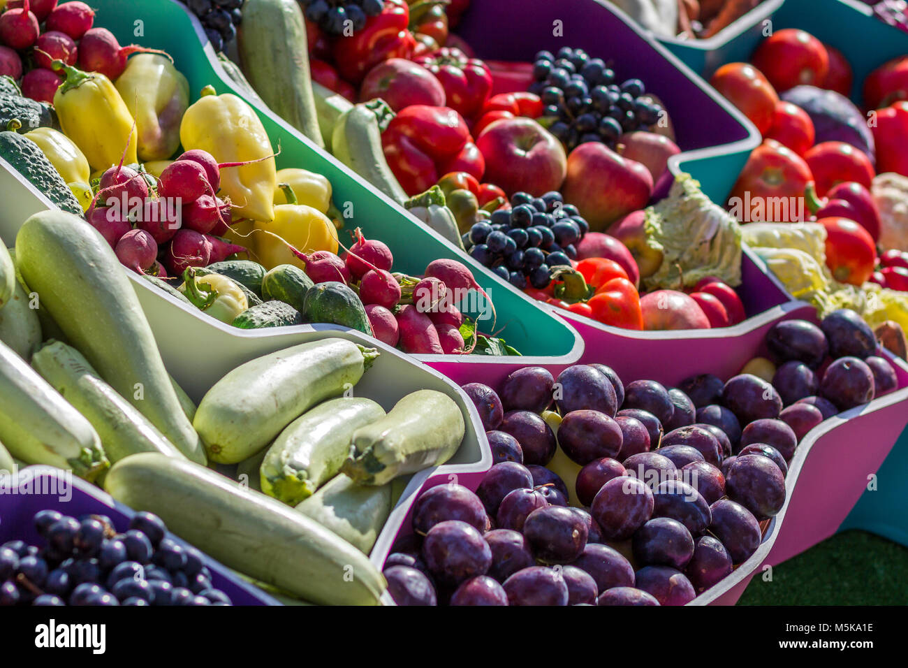 Farmers fruit market with various colorful fresh fruits and vegetables ...