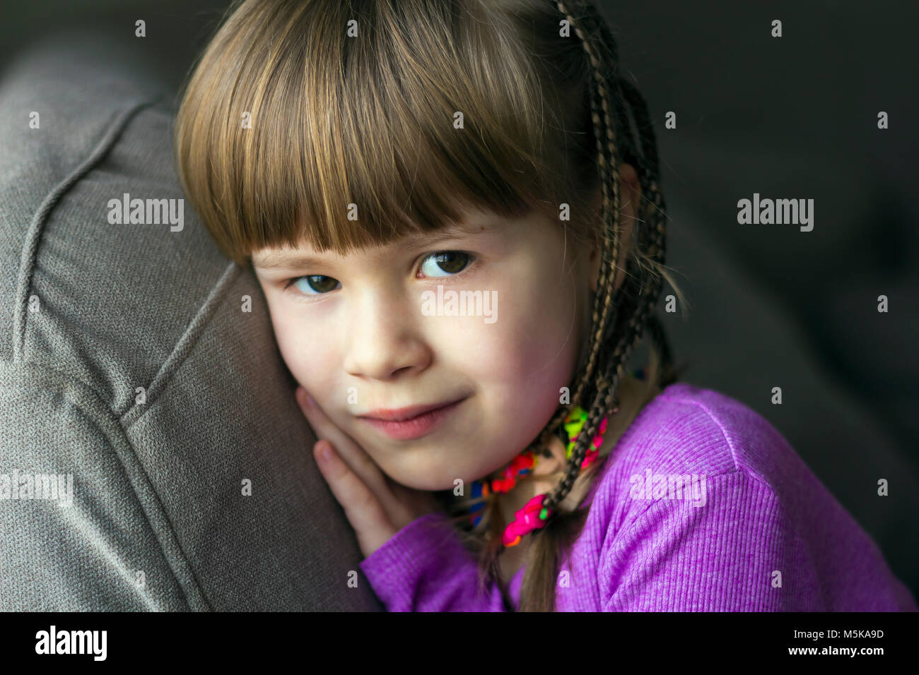 Portrait of pretty little girl with small braids Stock Photo - Alamy