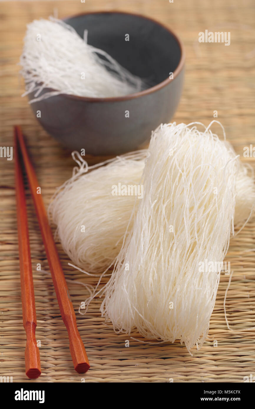 Cellophane noodles on a straw mat Stock Photo