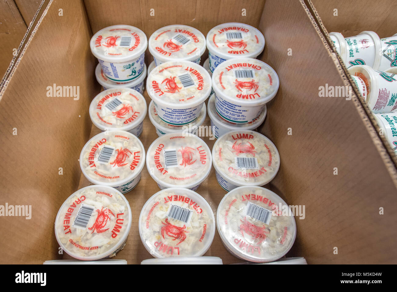 Stacked containers of lump crab meat ready to be shipped, Cambridge, Maryland. Stock Photo
