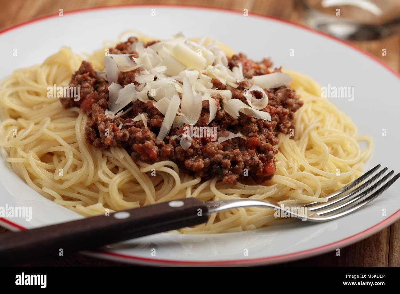 Spaghetti Bolognese with shredded Parmesan cheese Stock Photo Alamy